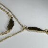Ketting en armband met veer-hanger