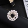 Broche ronde parel